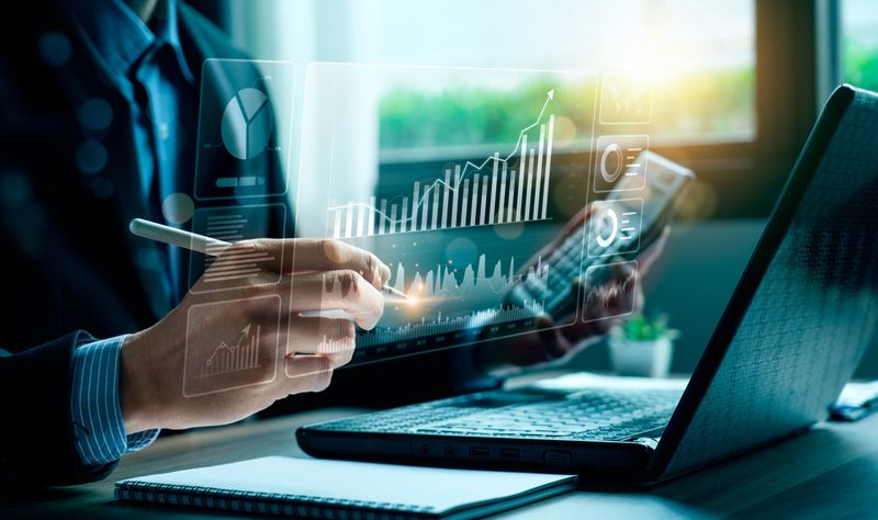 Professional analyzing holographic financial charts
